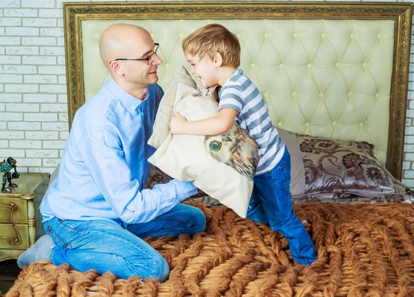 father and son in bed