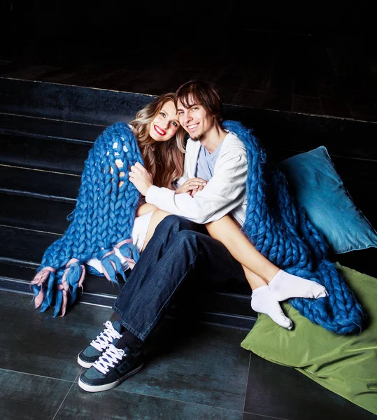 Happy beautiful young couple   with a   blanket — Stock Photo, Image