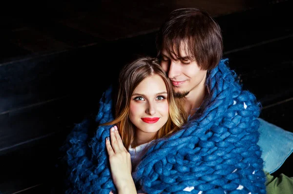 Happy beautiful young couple  with a  blanket — Stock Photo, Image