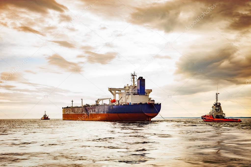 Tugboat towing a ship