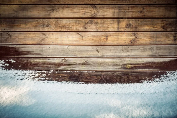 Grunge wooden board in snow. — Stock Photo, Image