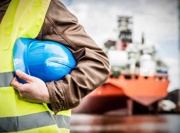 Man holding safety helmet — Stock Photo, Image