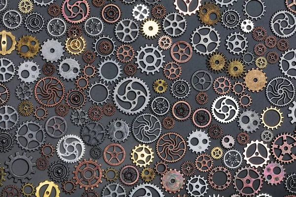 Different Cogwheels Laying Grey Background — Stock Photo, Image