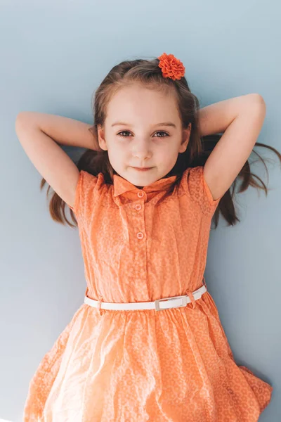 Portrait Young Carefree Child Laying Floor Hands Head — Stock Photo, Image