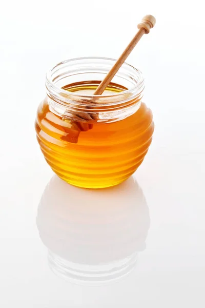 Pot met honing met honingraat — Stockfoto