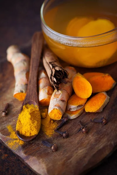aromatic turmeric tea with cinnamon cloves and ginger - healthy eating