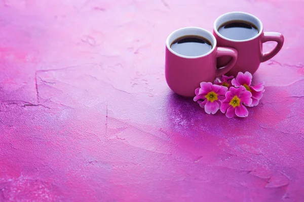 cup of spring coffee with primula flowers - food and drink