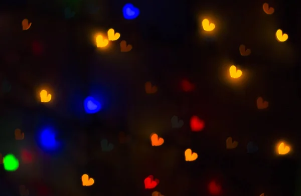 Θολή υπόβαθρο φωτεινά άντληση με χρωματιστές καρδιές — Φωτογραφία Αρχείου