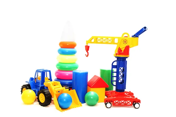 Färgglada leksaker på en vit bakgrund isolerad. — Stockfoto
