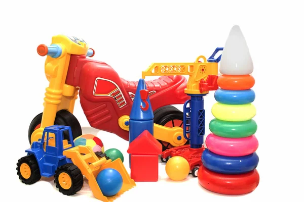 Brightly colored toys on a white background isolated. — Stock Photo, Image