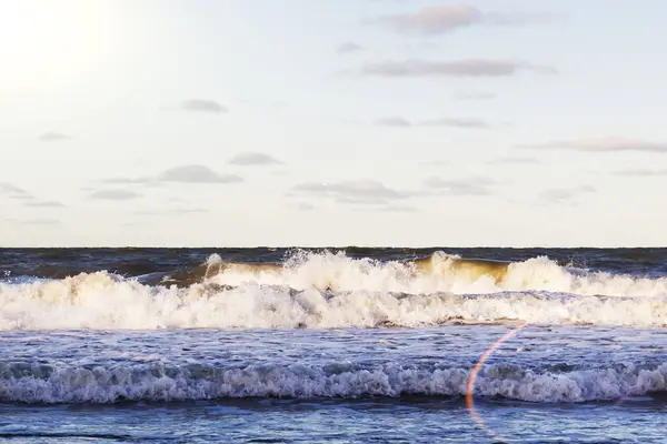 Sea wave on the beach at sunset time. — Stock Photo, Image