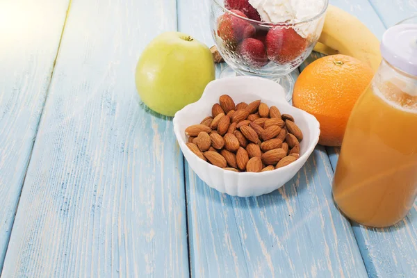 Traditional American and European summer Breakfast: berry, fruit Apple, strawberry, orange, banana. Light blue table. copy space. — Stock Photo, Image