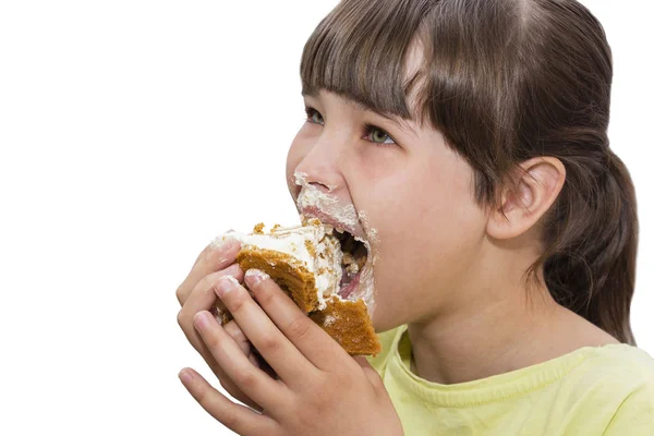 Girl eating cake. Isolated on white background. — Stock Photo, Image