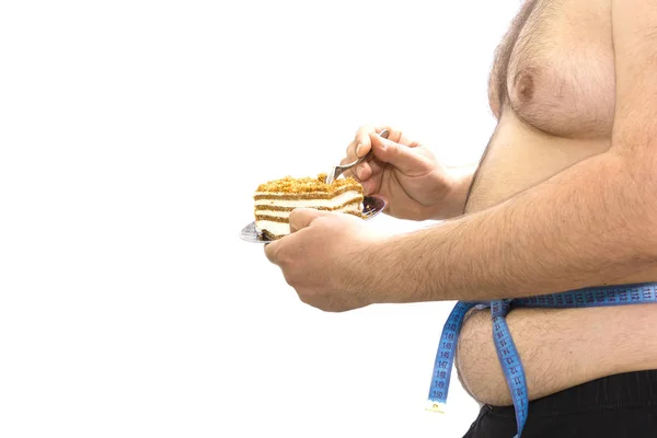 Fat guy eating cake — Stock Photo, Image