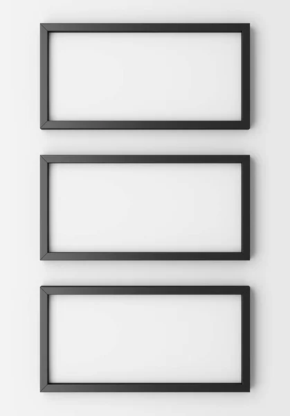 Three blank black photo frames on white wall. 3d illustration — Stock Photo, Image