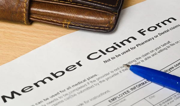 Member claim form on a wooden surface — Stock Photo, Image