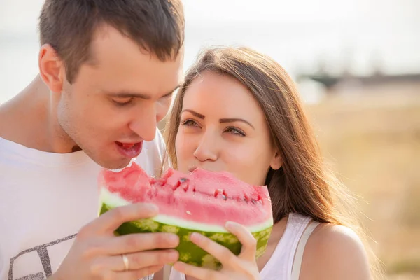 Smiling Young Couple Eating Fresh Melon Together — 스톡 사진