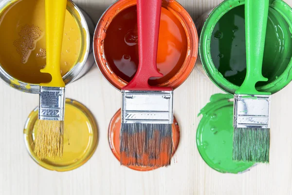 Brushes and cans with paint — Stock Photo, Image