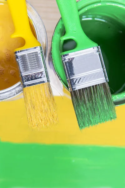 Brushes and cans with paint — Stock Photo, Image