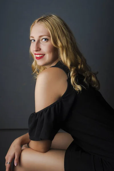 Beautiful girl in black dress — Stock Photo, Image