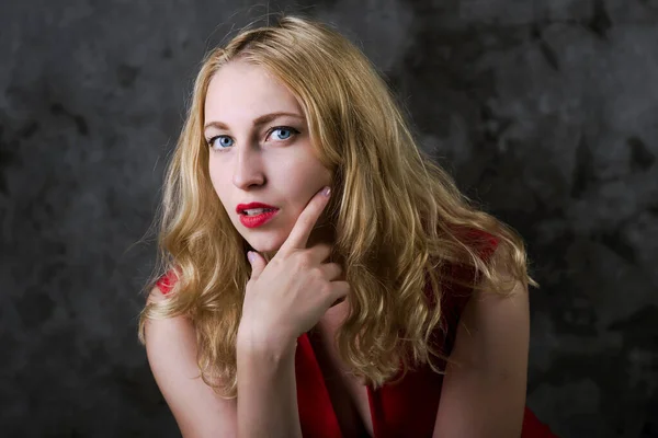 Portrait of  blonde girl in red dress — Stock Photo, Image