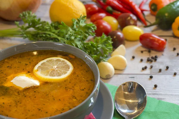 Plate with solyanka with vegetables on the table — Stock Photo, Image