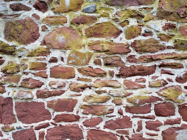 Stenvägg Som Bakgrund Röd Och Gul Sten — Stockfoto