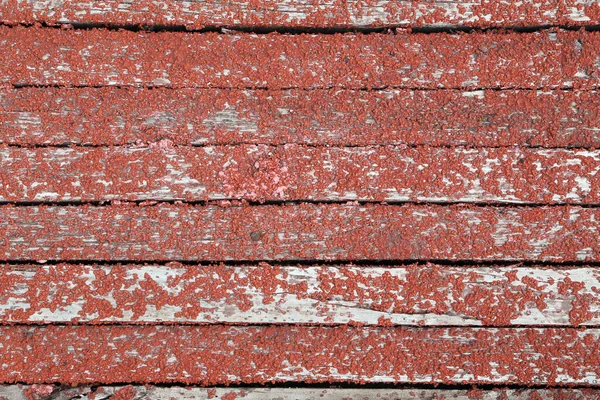 Vecchia Vernice Peeling Colore Rosso Uno Sfondo Legno — Foto Stock