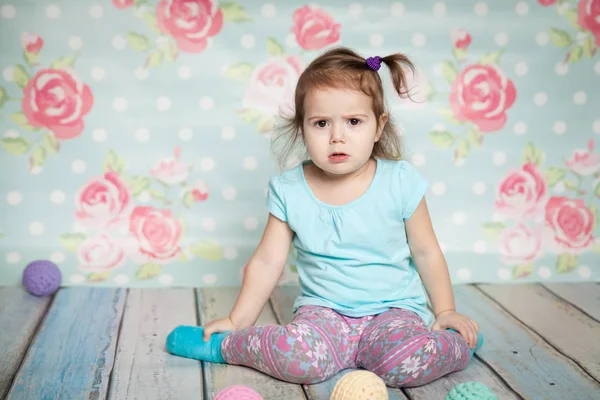 Little girl playing with her knitted toys — Stock Photo, Image