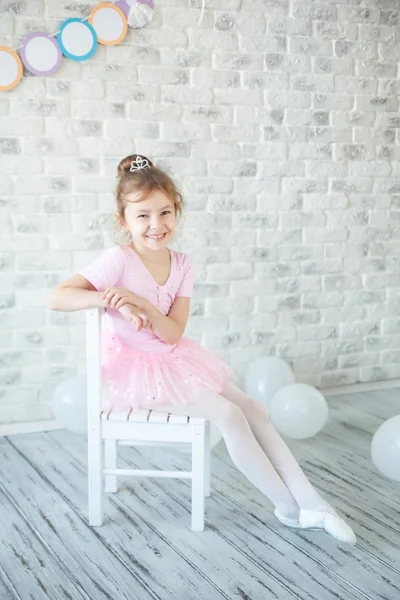 Little ballerina in a studio