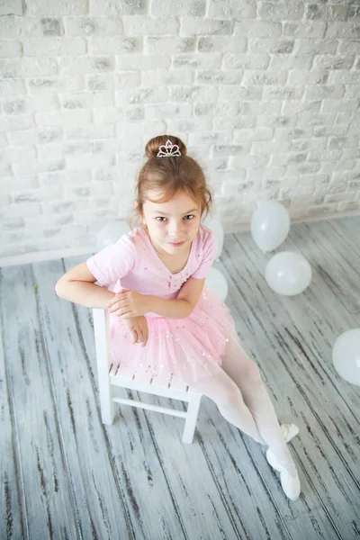 Little ballerina in a studio