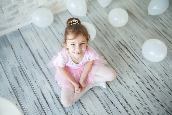 Little ballerina in a studio