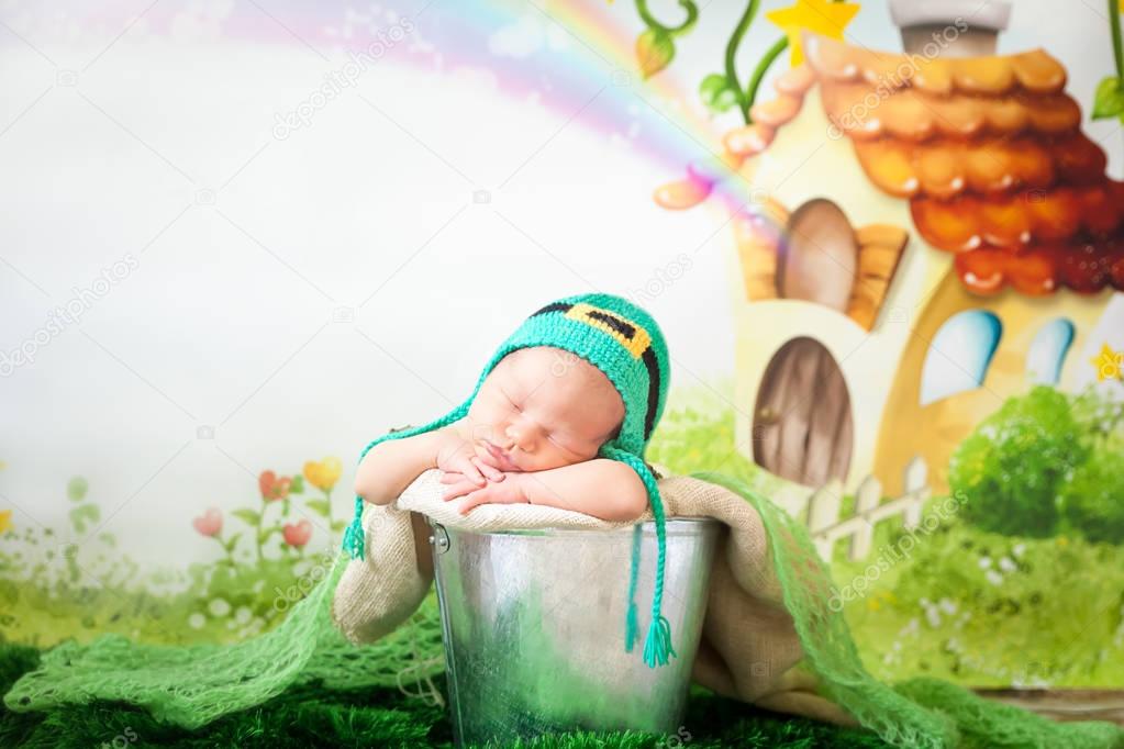 Sleeping newborn baby in a St. Patricks Day hat