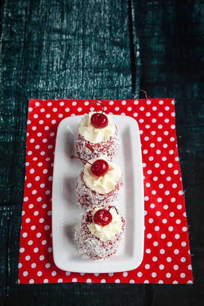 Red Cupcakes Whipped Cream Cherry Coconut Chips Red Fabric — kuvapankkivalokuva