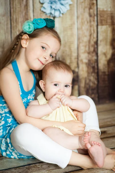 Pretty sisters in easter decorated studio — Stock Photo, Image