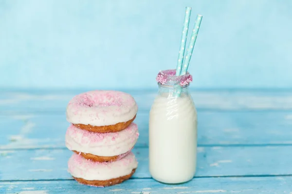 Tasty donuts with pink sprinkles — Stock Photo, Image