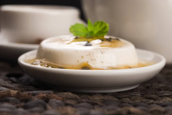 Panna cotta dessert with passion fruit and mint — Stock Photo, Image