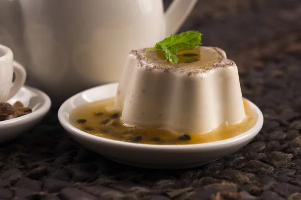 Panna cotta dessert with passion fruit and mint — Stock Photo, Image