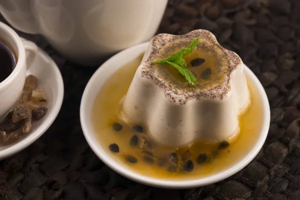 Panna cotta dessert with passion fruit and mint — Stock Photo, Image