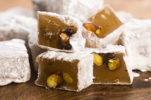 Turkish delight on wooden background — Stock Photo, Image