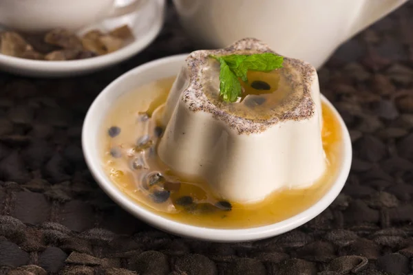 Panna cotta dessert with passion fruit and mint — Stock Photo, Image