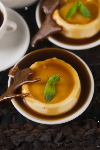 Caramel dessert and vanilla herb — Stock Photo, Image