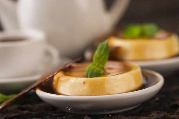 Caramel dessert and vanilla herb — Stock Photo, Image