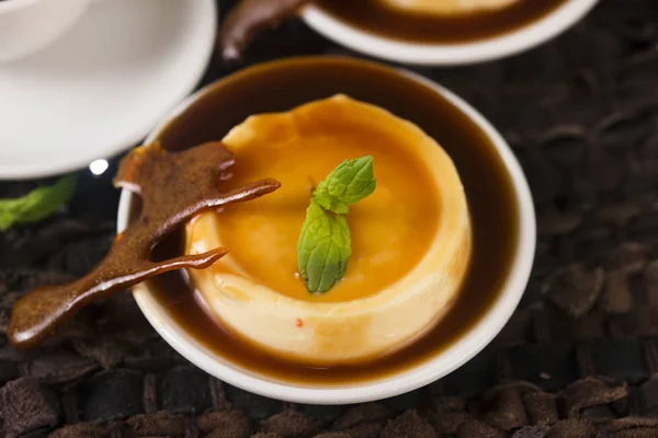 Caramel dessert and vanilla herb — Stock Photo, Image