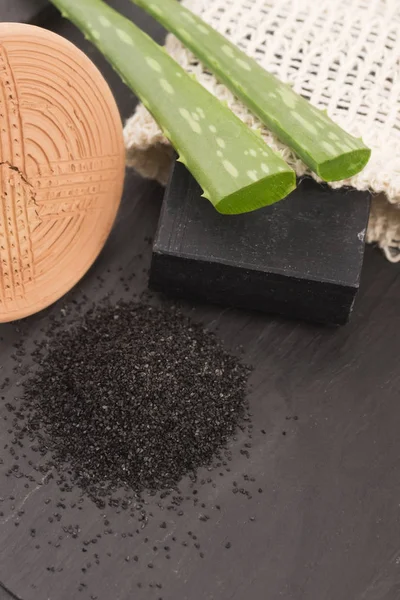 Stock image block of natural carbon soap with aloe vera