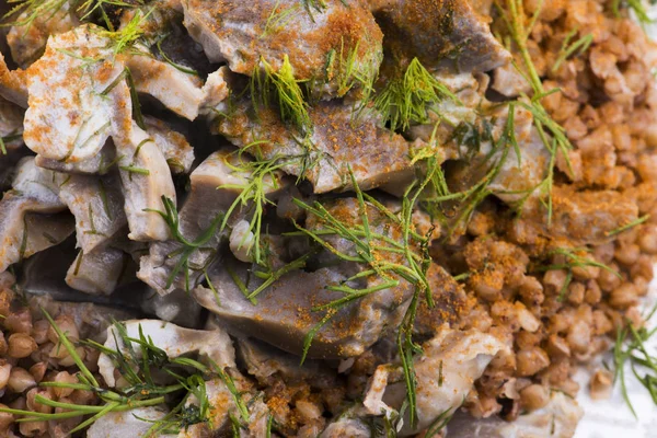 Stewed turkey stomachs with vegetables and buckwheat in a bowl Royalty Free Stock Photos