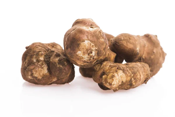 Raw Whole ans sliced Jerusalem artichokes on a white background — Stock Photo, Image