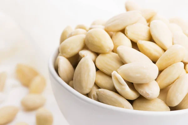 Bowl of almonds on a white background — Stock Photo, Image