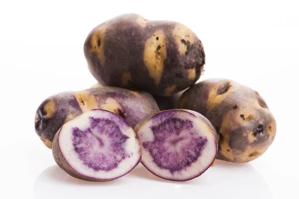 White - violet potato on a white background. Organic plant — Stock Photo, Image