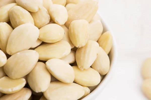 Bowl of almonds on a white background — Stock Photo, Image